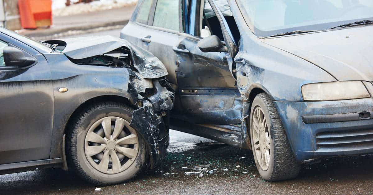 Two wrecked cars--one was t-boned by another in the passenger side door.
