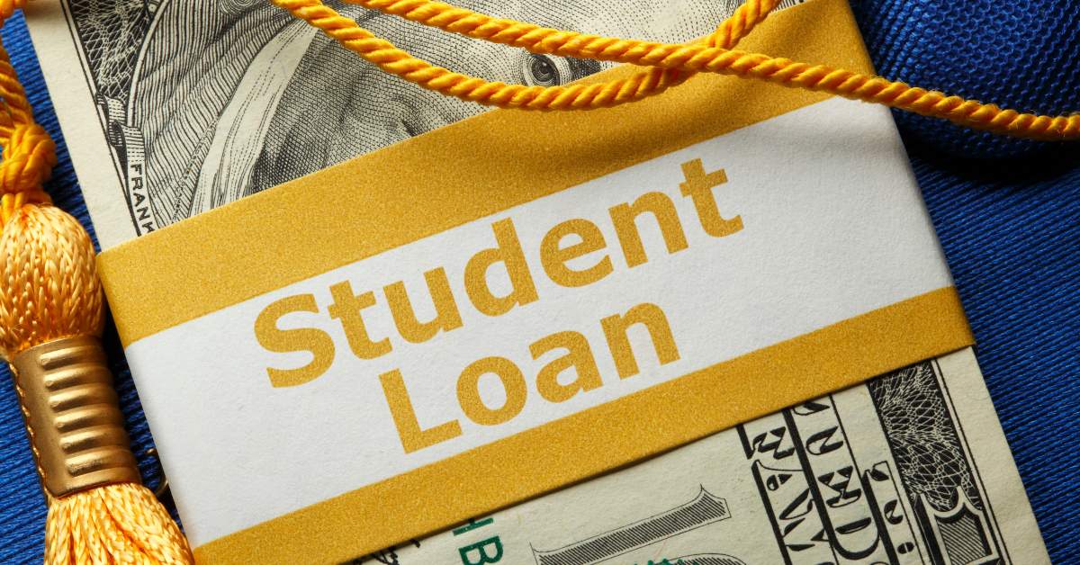 Picture of a stack of money with "student loan" written on the band around it.